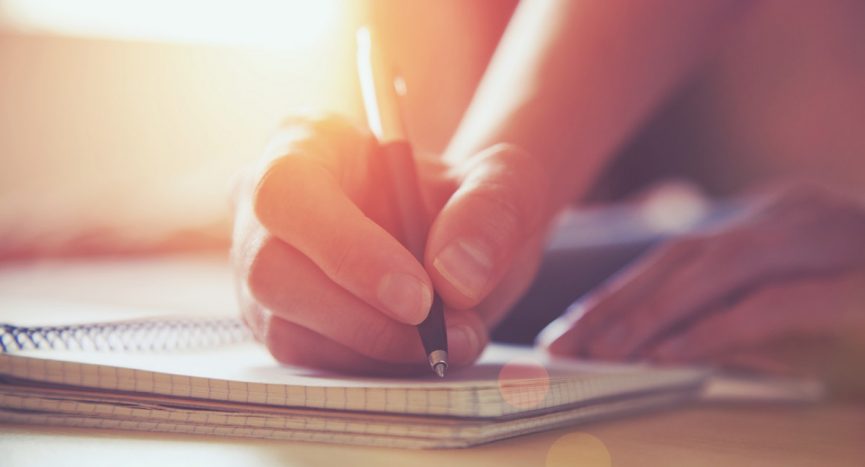 person writing an intervention letter