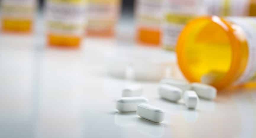 prescription pills spilling out of bottle