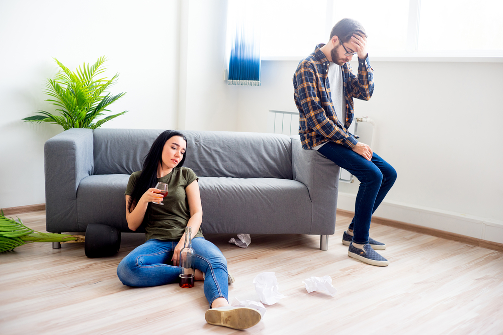 man and woman experiencing hangovers
