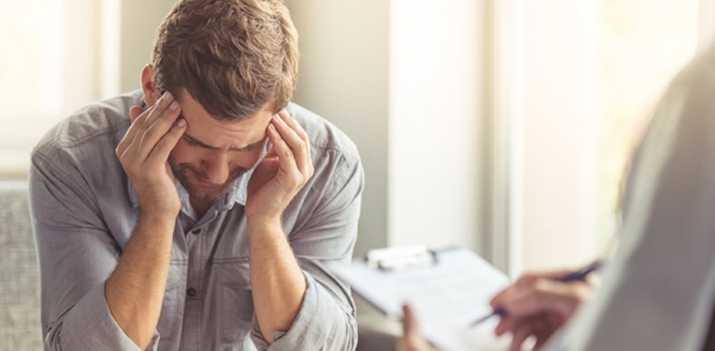 distressed man in therapy session