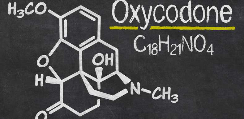 Oxycodone and its chemical formula written on chalkboard
