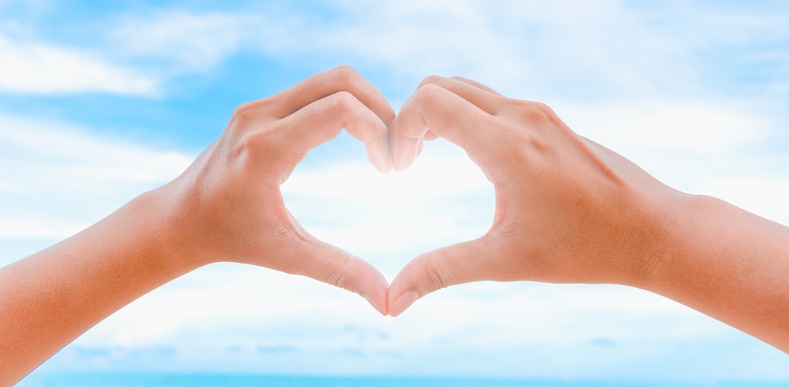 person making heart with hands