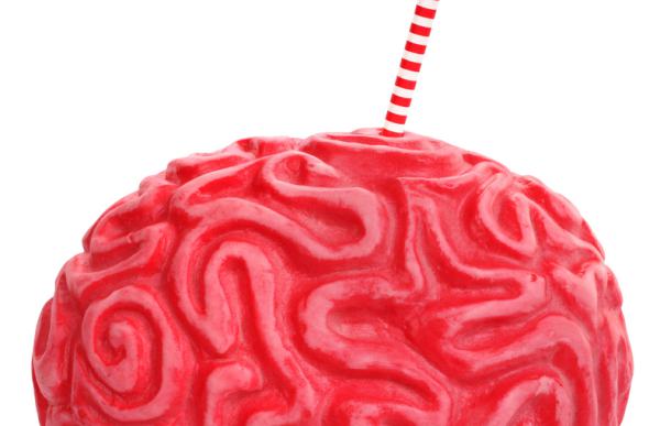 Plastic red replica of a brain with a straw.