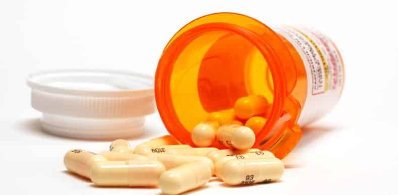 Bottle of pills on its side.