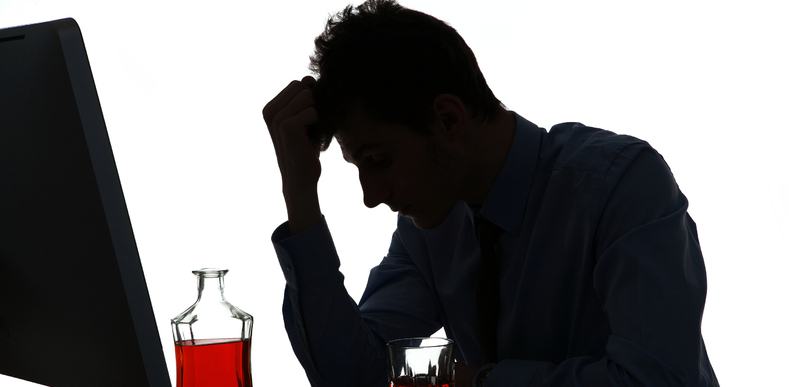 silhouette of a man drinking at work