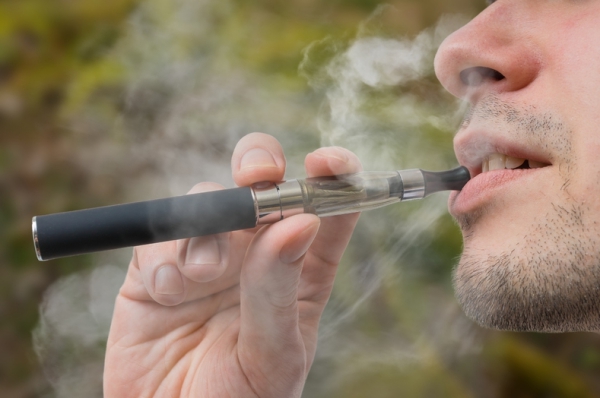 Person using an e-cigarette.