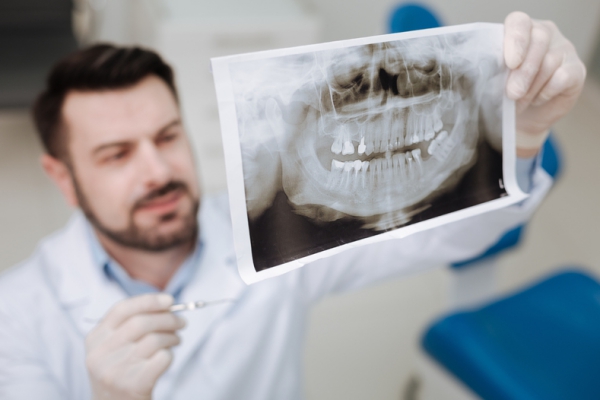 Dentist looking at x-rays.