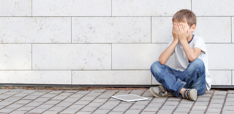 Child covering his eyes