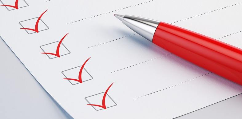 checklist with a red pen