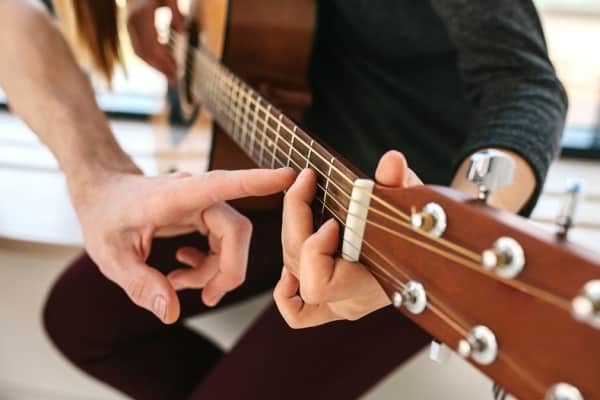 person playing the guitar