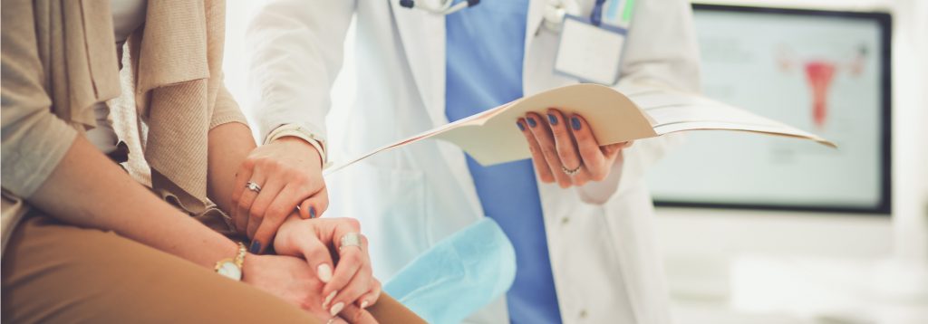 A doctor consoling a patient