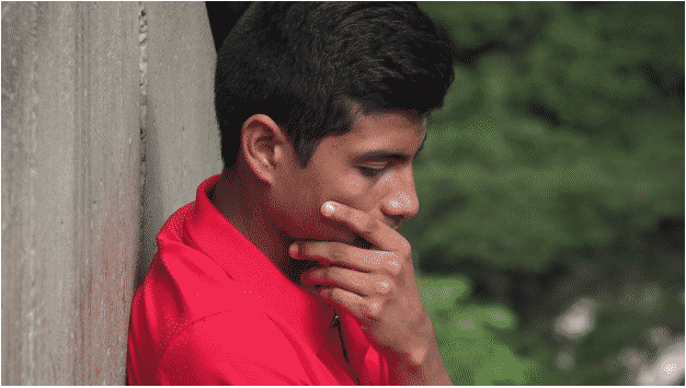 man feeling embarrassed due to addiction stigma