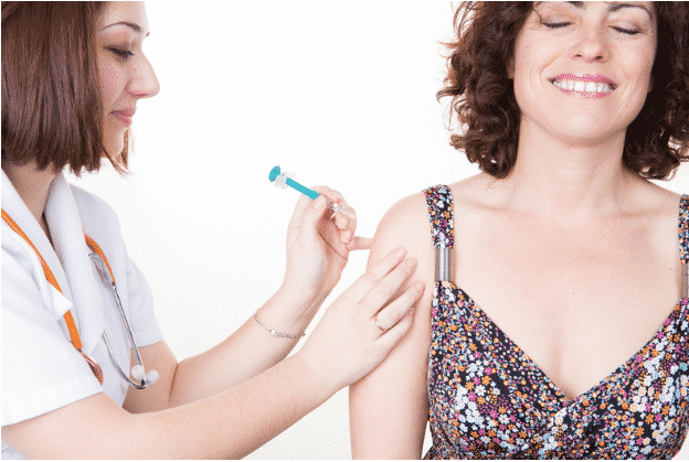 woman receiving heroin vaccine in arm