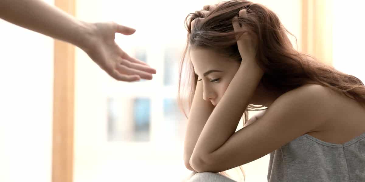 woman going through Heroin detox being offered a helping hand