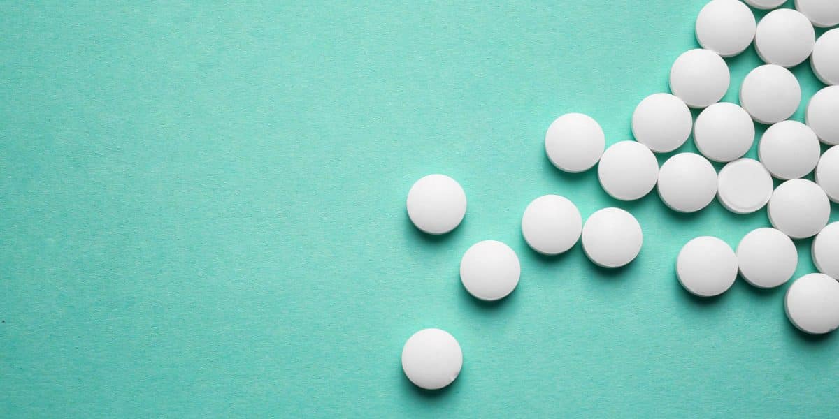 Ritalin pills on green counter