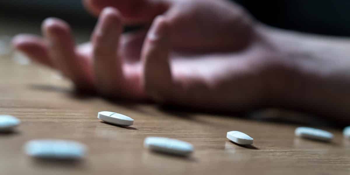 hand of person lying on the floor after overdosing on Klonopin
