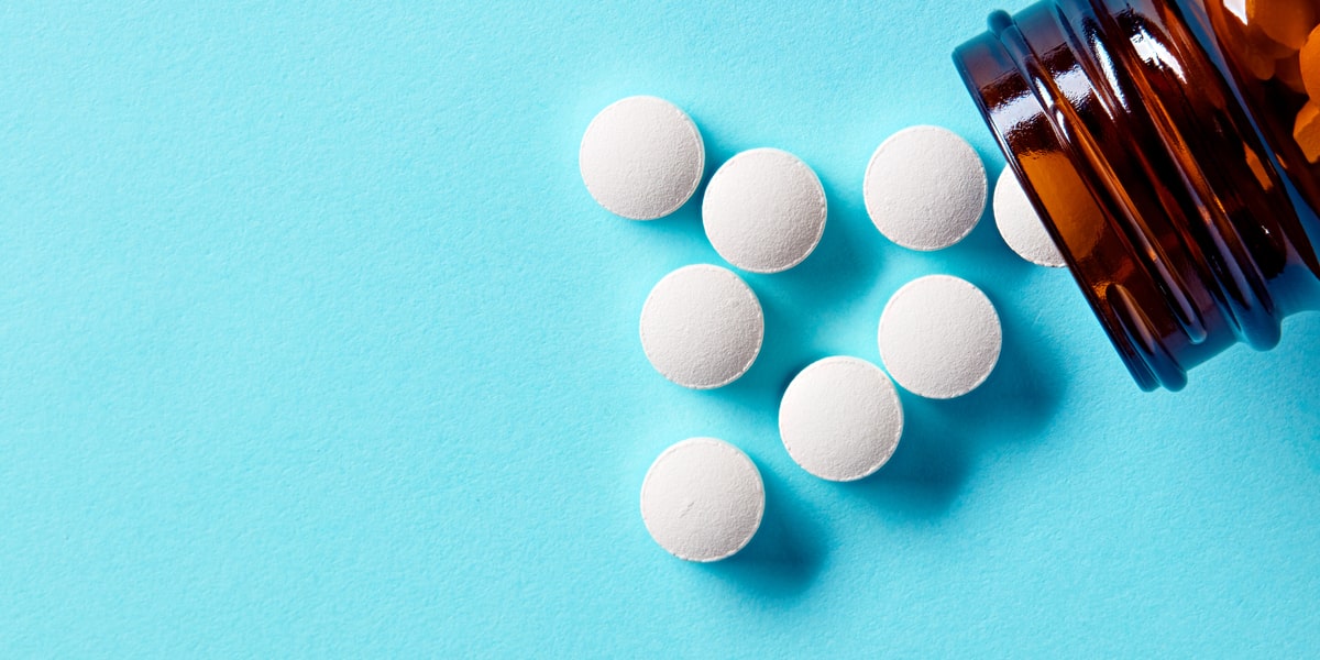 Ritalin pills spilling out of container