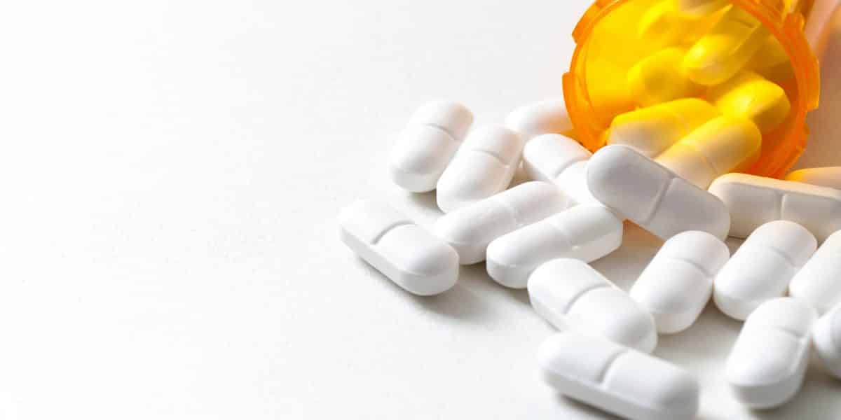 Vicodin pills spilling out of a prescription bottle