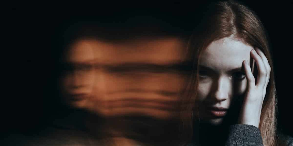 woman experiencing headache after using DMT