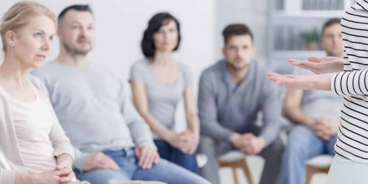 A group of people struggling with stimulant addiction at group therapy as part of stimulant abuse treatment