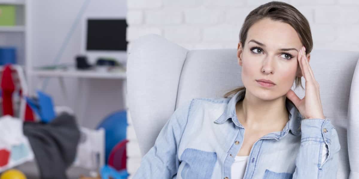 Woman sitting in a chair with a frustrated look on her face due to tapering off xanax