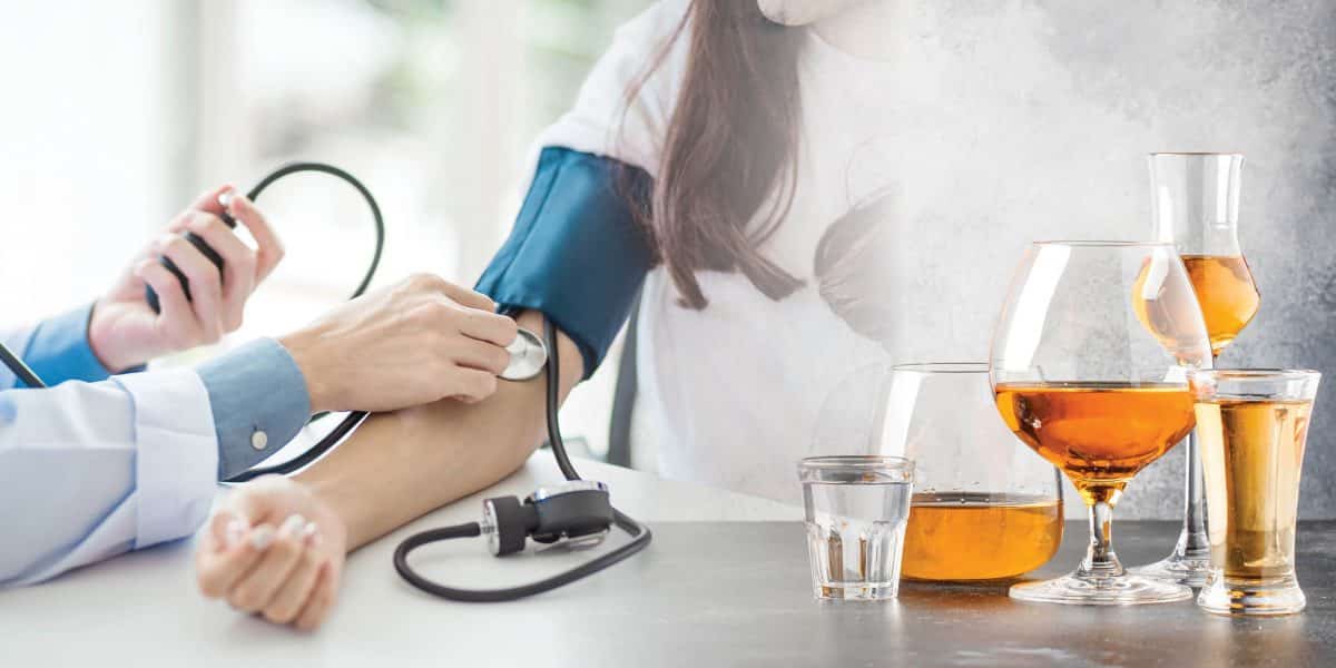 A doctor taking the blood pressure of a patient next to an image of various glasses of alcohol