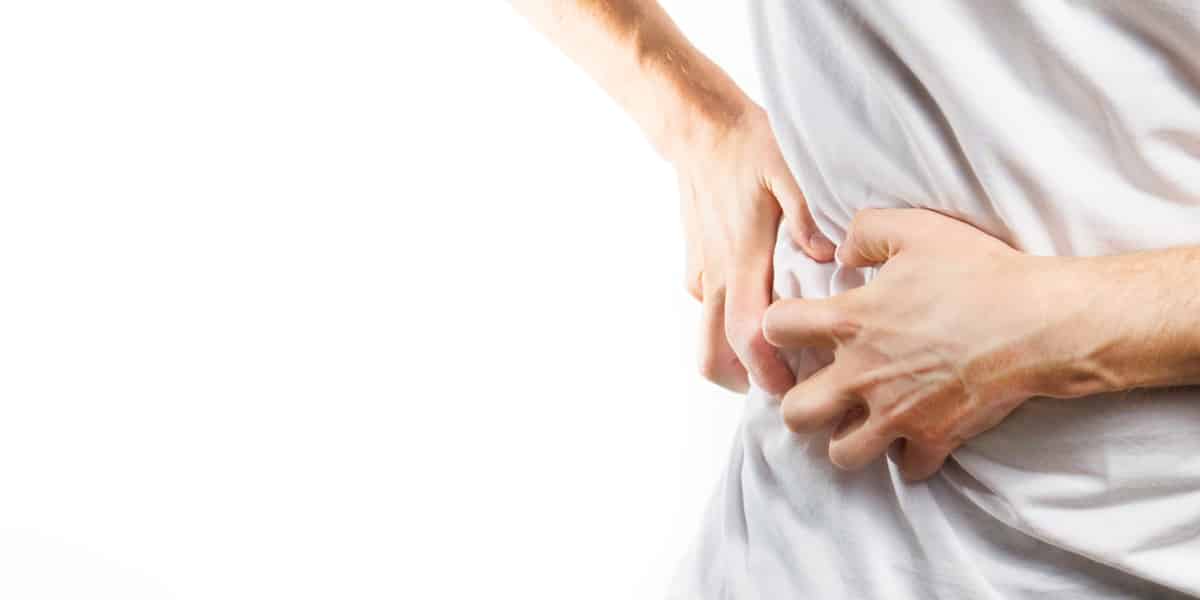 person holding side from kidney stone